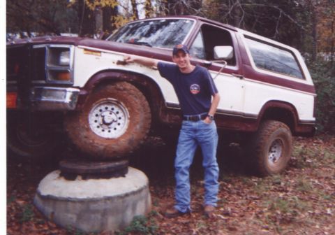 1981 Ford Bronco - Man poses with a lifted 1980s Ford Bronco, which appears to be from the early 1980s.