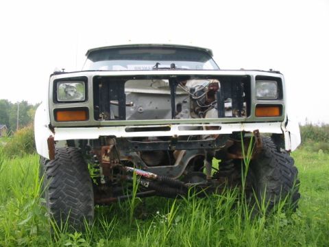 1985 Ford Bronco - This truck is missing its grille and engine, and appears to be in a state of disrepair.