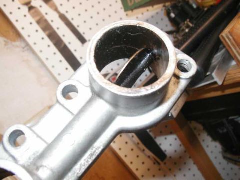 1993 Ford Taurus - A close-up view of a metal component, likely a car part, with a hollow cylindrical section visible.