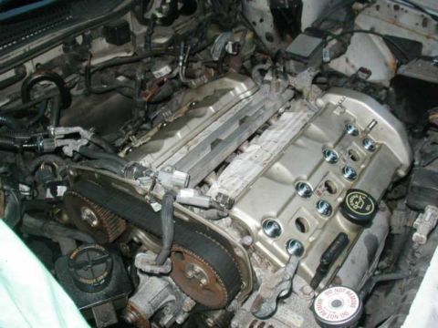 1993 Ford Taurus - Close-up view of a vehicle's engine compartment, showing internal components and wiring.