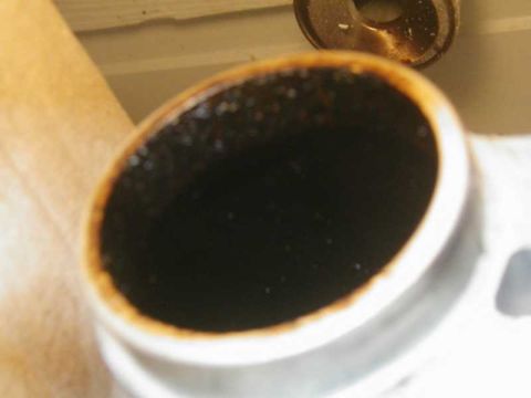 1993 Ford Taurus - The interior of an exhaust pipe shows significant carbon buildup.