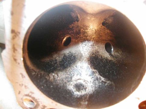 1993 Ford Taurus - This is a close-up view of an engine's intake port, showing significant carbon deposits.