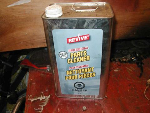 1993 Ford Taurus - A can of Revive Professional Parts Cleaner sits on a red surface with other items in the background.