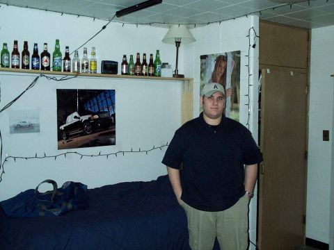 1985 Ford LTD Crown Victoria - A poster of a black pickup truck hangs on the wall above a bed.