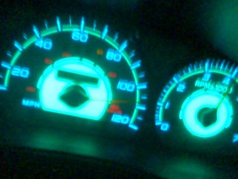 1998 Mercury Sable - The illuminated dashboard gauges show speed and RPM readings.