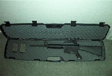 1995 Ford Bronco - Rifle and magazines inside a protective carrying case.