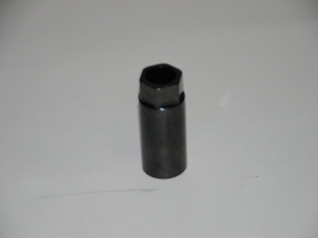 Dark gray socket wrench with hexagonal opening, isolated on a light gray background