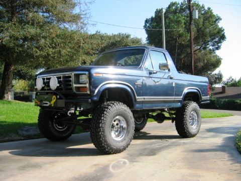 1985 Ford Bronco - This lifted Ford Bronco features off-road modifications and a distinctive body style from the early 1980s.