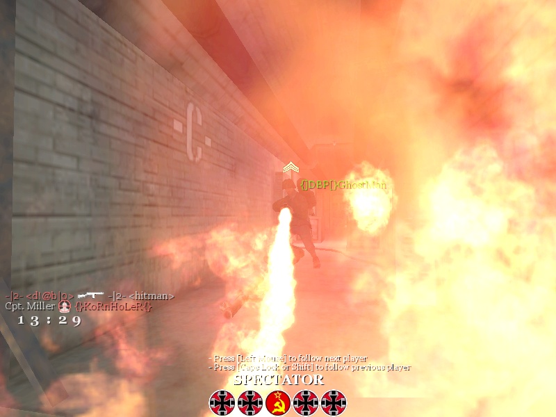 Flamethrower user in a burning hallway
