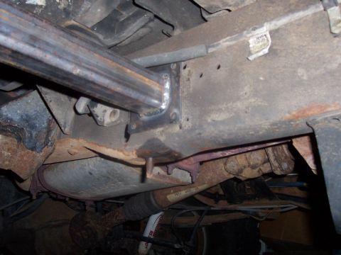 1994 Ford Bronco - Aftermarket sliders are welded to the frame of this vehicle, showing a close-up of the underbody construction.