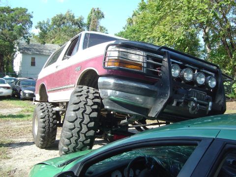 1993 Ford Bronco - This heavily modified 1993 Ford Bronco features oversized tires and a robust front brush guard.
