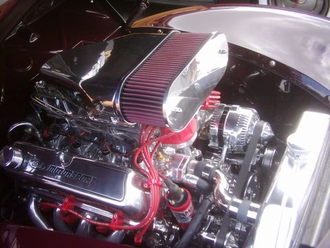1978 Ford Bronco - A highly polished Ford Motorsport engine is visible under the hood of a custom vehicle.