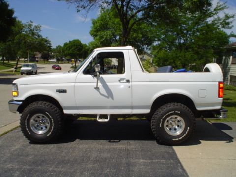 1993 Ford Bronco - White 1993 Ford Bronco lifted on BFGoodrich Mud-Terrain T/A tires, parked on a driveway.