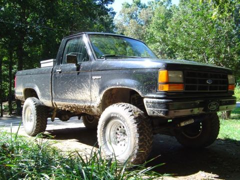 1989 Ford Ranger - This lifted 1989 Ford Ranger pickup truck is covered in mud, suggesting recent off-road use.