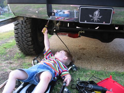 1991 Ford Bronco - My 3 year old working on the truck while Dad takes a break.