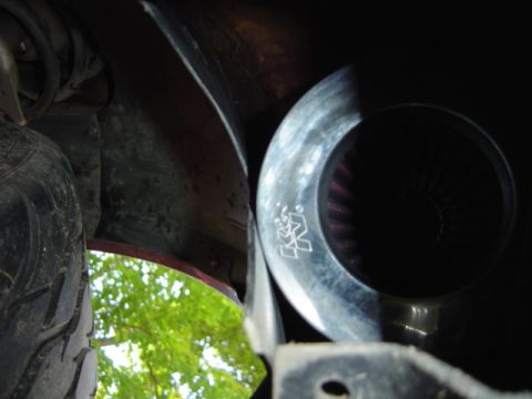 1998 Ford Taurus - Close-up of a K&N air filter intake system, showing the red filter element.