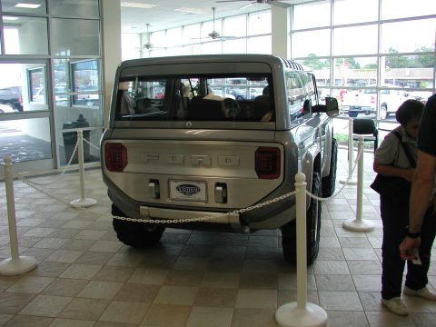1985 Ford Bronco - This concept SUV, likely not a 1985 model, is displayed indoors with stanchions and ropes.