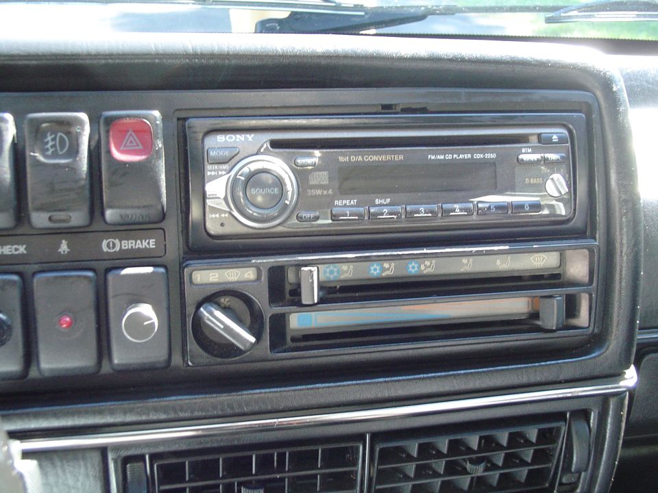 Car dashboard with Sony CD player, hazard lights, and climate controls