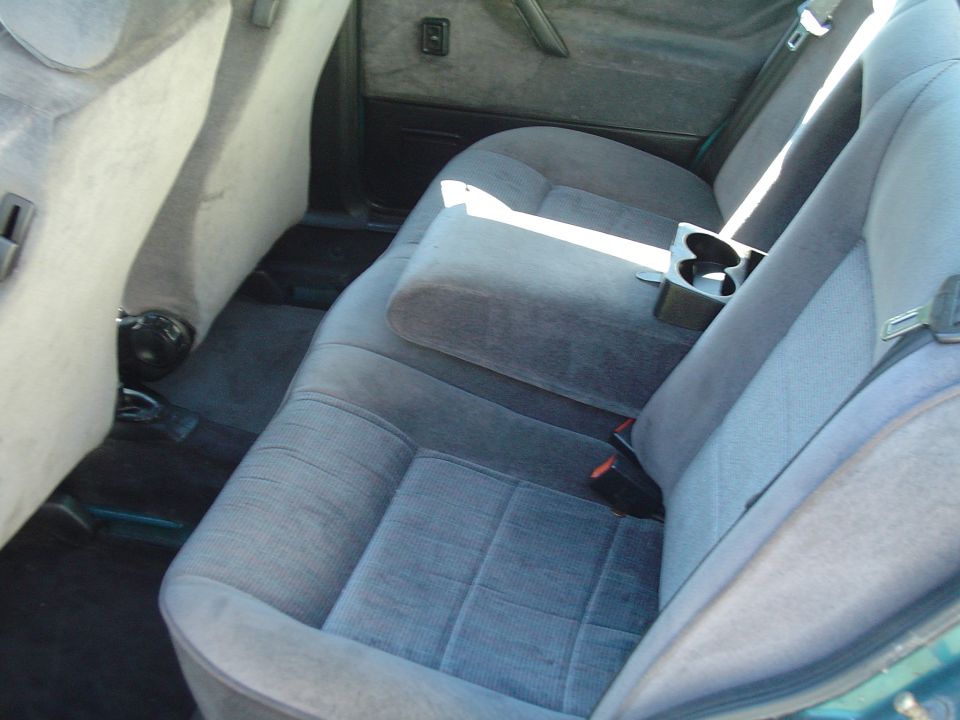 Interior rear seats with center console and cup holders