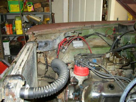 1995 Ford Bronco - Close-up view of a vehicle's engine bay, showing various mechanical components and wiring.