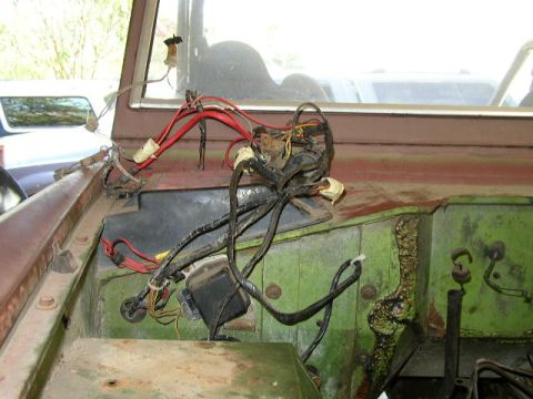 1995 Ford Bronco - The exposed wiring harness in this vehicle's engine bay appears to be in disarray.