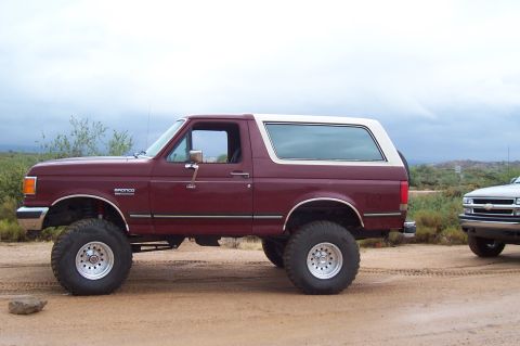 1992 Ford Bronco - This 1992 Ford Bronco features a lifted suspension and a two-tone paint scheme with a white top.