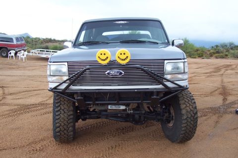 1992 Ford Bronco - This Ford Bronco features an aftermarket off-road bumper and custom yellow lights with smiley faces.