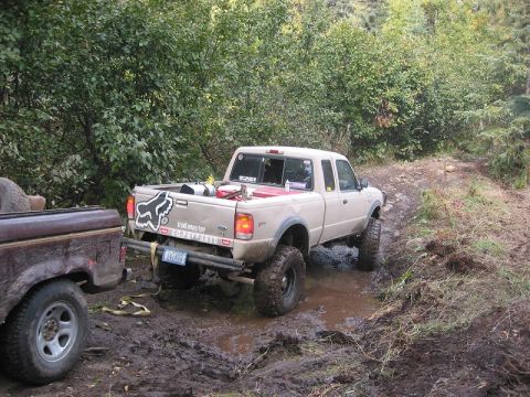 1985 Ford Bronco - Jon pulling the BII away from the tree so that we could hook me to the front.