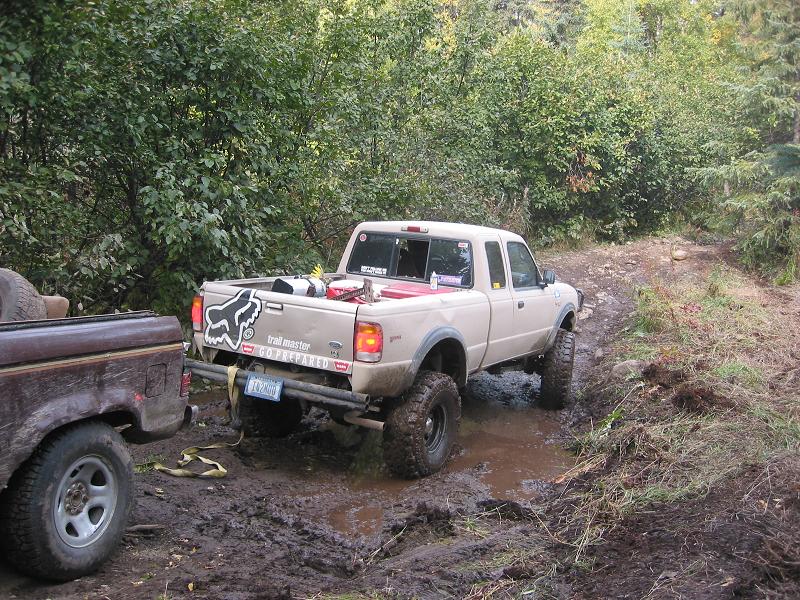 Jon pulling the BII away from the tree so that we could hook me to the front.