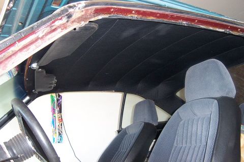 1966 Ford Fairlane - Interior view of a car's headliner and seats, with visible water damage around the windshield frame.