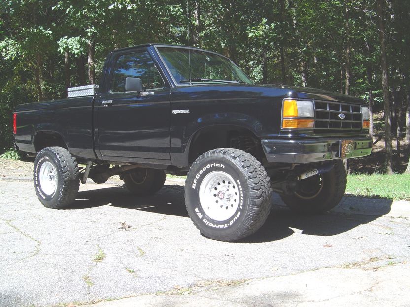 Black 1989 Ford Ranger pickup truck with lifted suspension and off-road tires
