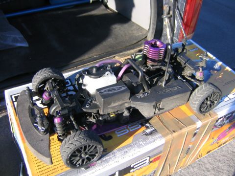 1994 Ford Bronco - A radio-controlled car sits on its packaging, with a visible engine and wheels.