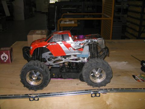 1994 Ford Bronco - This remote control monster truck features a red and silver body with 'SAVAGE 25' branding.