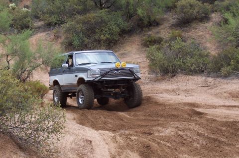 1992 Ford Bronco - This two-tone 1992 Ford Bronco is equipped for off-road adventures with its lifted suspension and custom bumper.