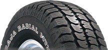 1985 Ford F-150 - Close-up of a Baja Radial MT tire, showing tread pattern and sidewall text.