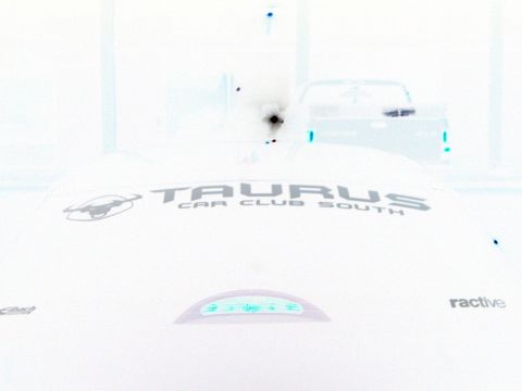 1993 Ford Taurus - Logo for Taurus Car Club South is visible on the hood of a car, with a pickup truck in the background.