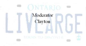 2003 Ford Excursion - An Ontario license plate displaying the slogan 'LIVE LARGE' and personalized text 'Moderator Clayton'.