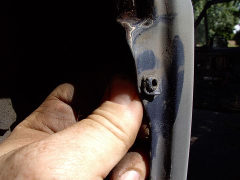 1986 Ford Bronco - These little plastic inserts for the tail light lens screws are not the sort of things you want to be throwing away. Sqeeze them from behin…