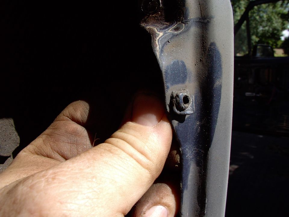 These little plastic inserts for the tail light lens screws are not the sort of things you want to be throwing away. Sqeeze them from behind and push them out, then .......