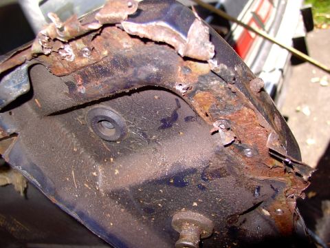 1986 Ford Bronco - After drilling out the end spot welds peel back the end tabs to get ready for removal.