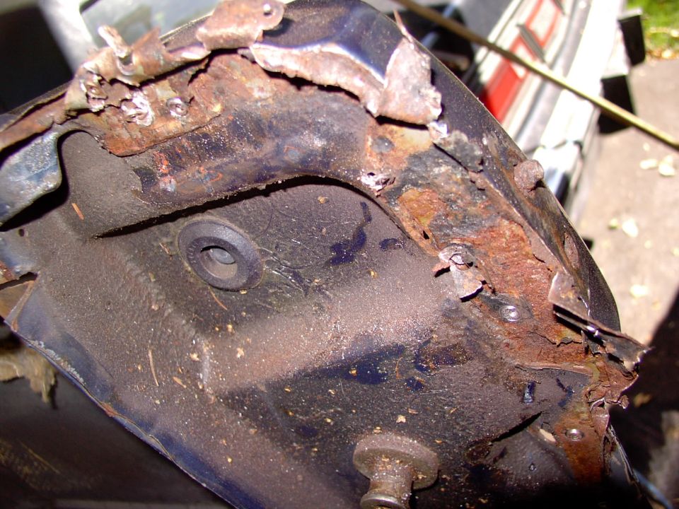After drilling out the end spot welds peel back the end tabs to get ready for removal.