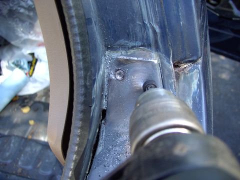 1986 Ford Bronco - After wire brushing the seam filler out of the picture, drill out the spot welds on the A pillar.