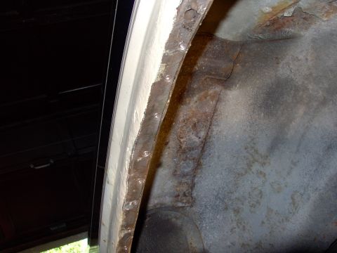 1986 Ford Bronco - Here's the wheel well part of quarter drilled out waiting to be seperated.