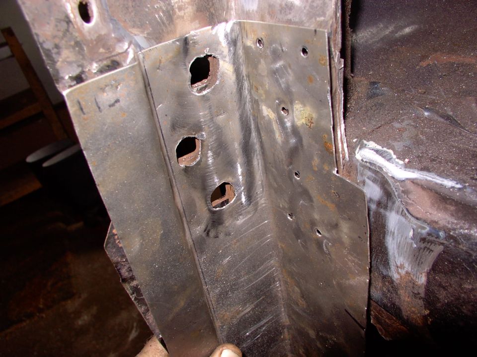 Not bad fit for on the spot fabrication with the rubber mallet.  The small holes are to allow a few button welds. Just beat into place for fit.
