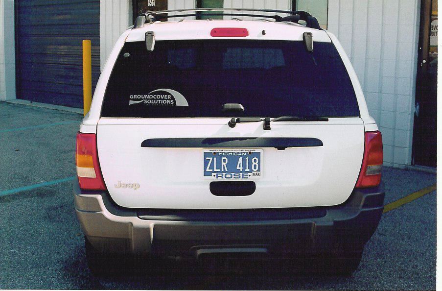 1999 Jeep Grand Cherokee rear view with Michigan license plate ZLR 418
