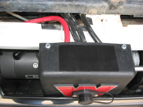 1995 Ford Bronco - solenoid mount again, this time with Grille removed. Note black plastic edging to protect cables. Solenoid ziptied to the white metal body…