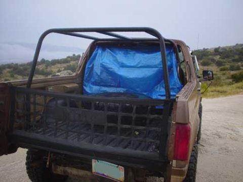 1989 Ford Bronco - This 1987 Ford Bronco is covered with a blue tarp in the cargo area.