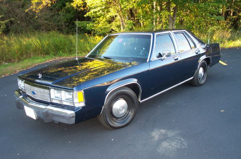 1991 Ford LTD Crown Victoria - This 1991 Ford Crown Victoria is seen from a three-quarter front view, parked outdoors.