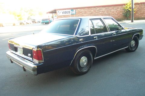 1991 Ford LTD Crown Victoria - Rear three-quarter view of a 1991 Ford Crown Victoria LTD sedan.