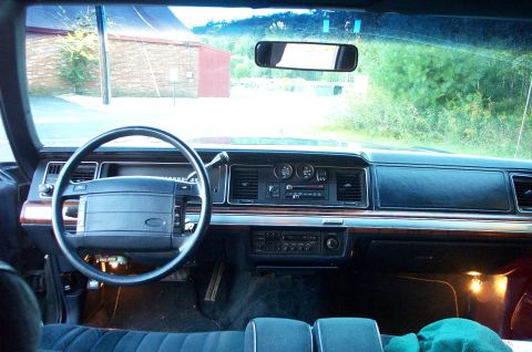 1991 Ford LTD Crown Victoria - Interior view of a 1991 Ford Crown Victoria LTD, showing the dashboard and front seats.